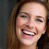 Client Emily smiling after haircut